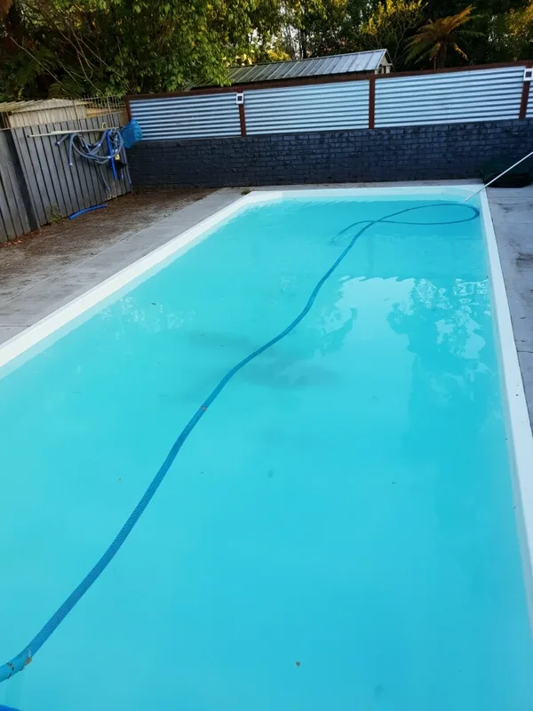 The same pool clear and blue after a green pool start-up