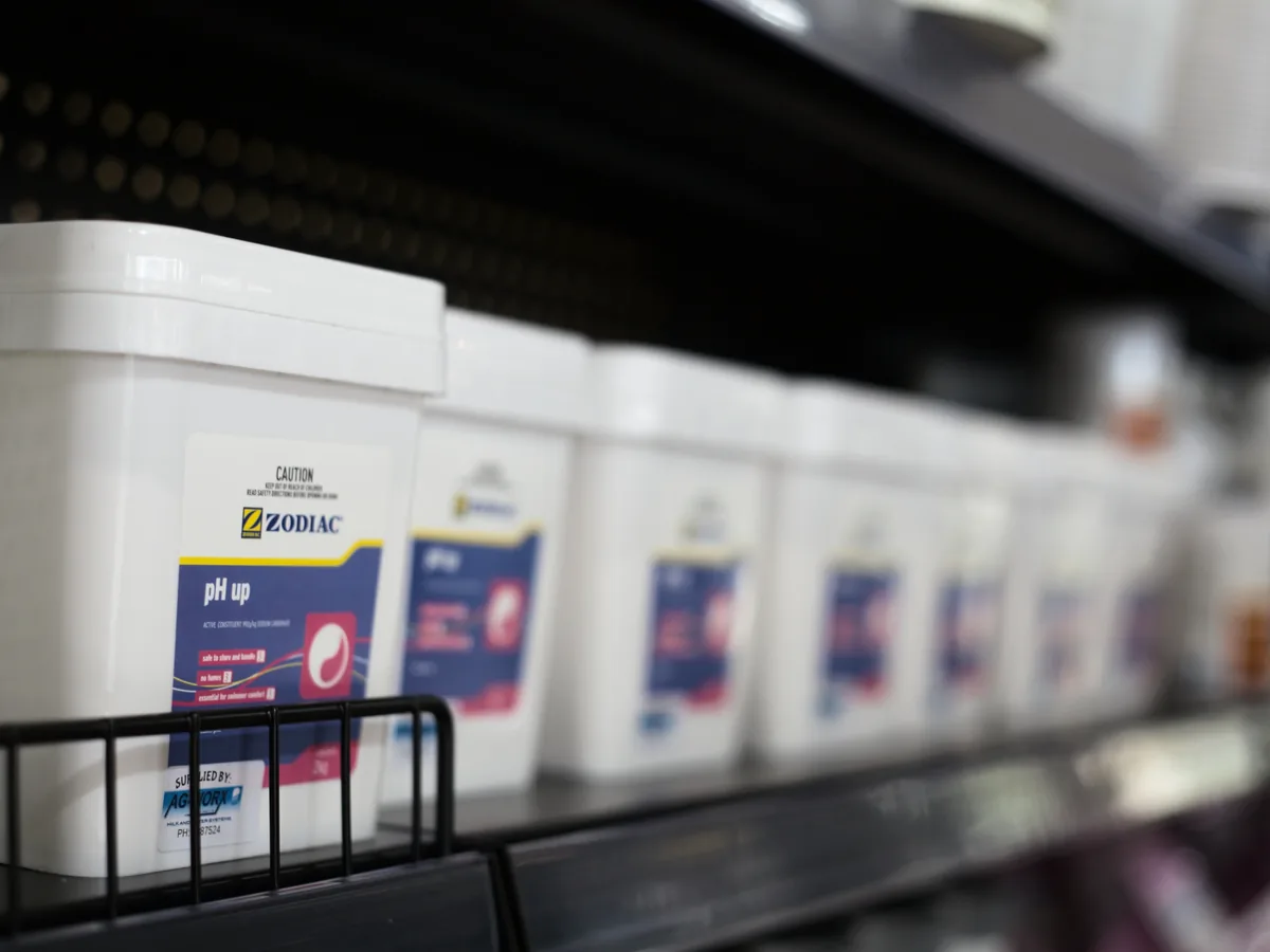 Tubs of Zodiac pool chemical on the shop shelf